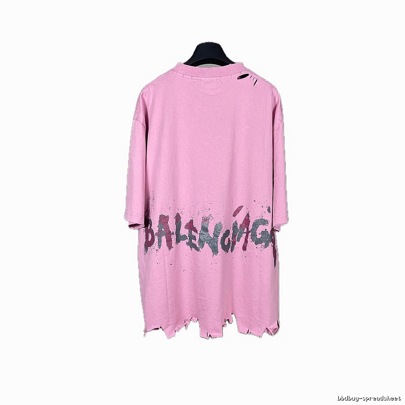 Balenciaga's pink T-shirt with a hole and graffiti style